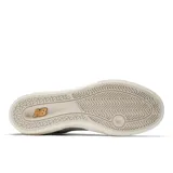 Championes urbanos New Balance modelo NM272LMP, color gris con detalles en negro, confeccionados en gamuza y lona, con logo "N" característico en los laterales y suela blanca.