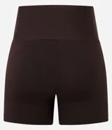 Bermuda deportiva de tiro alto confeccionada en microfibra de poliamida y elastano, con diseño liso y ajuste ceñido.