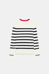 Jersey Zara de punto liso color negro, con cuello redondo, manga larga y detalle de botones dorados en los puños.