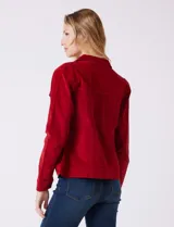 Campera de pana color rojo, marca Dash, con cuello solapa, abertura central con botones metálicos y bolsillos delanteros.
