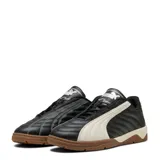 Championes de fútbol sala Puma modelo Tifosi Calcio Ls, color negro con detalles en blanco y suela de goma color caramelo. Presentan un diseño acolchado con costuras visibles y el logo de la marca en la lengüeta.