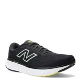 Championes de running New Balance Evoz Fresh Foam para hombre, color negro con entresuela blanca y suela negra con detalles amarillos. Presentan el logotipo 'N' en los laterales en color verde claro y tecnología Fresh Foam en la entresuela para mayor amortiguación.