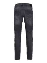 Jean de corte slim con tiro bajo, confeccionado en denim de color negro con efecto lavado. Presenta diseño clásico de cinco bolsillos y cierre frontal con botón.
