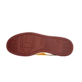 Championes Puma RBD Game Low, color azul marino con detalles en blanco, amarillo y rojo.