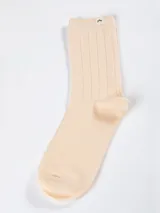 Pack de tres pares de medias acanaladas de algodón en colores pastel: celeste, lila y beige.