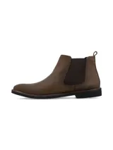 Botin tipo Chelsea de cuero color marrón, con paneles laterales elásticos y suela de goma negra.