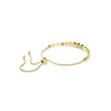 Pulsera dorada con cristales blancos redondos engarzados en bisel.