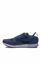 Championes deportivos Fila modelo Jogger Sport II, color azul marino, con suela gris y blanca, y detalles de la marca bordados en el lateral.