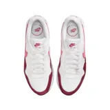 Championes Nike Air Max SC con diseño deportivo, cuerpo blanco con superposiciones de gamuza en color bordó y logo lateral en tono rosado. Cuenta con unidad de aire visible en la entresuela.