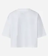 Remera cropped de manga corta, cuello redondo y calce oversized, confeccionada en tejido de algodón tipo media malla.