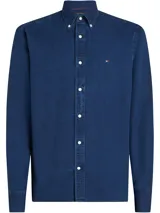 Camisa de manga larga Tommy Hilfiger de algodón chambray azul. Tiene cuello abotonado, cierre con botones y logo bordado en el pecho.