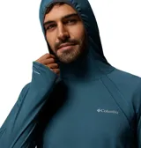 Buzo Columbia Stealth Spring LS color azul con capucha, de manga larga con orificios para los pulgares, confeccionado con tecnologías Omni-Shade y Omni-Wick para protección solar y absorción de humedad.