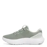 Championes de running Under Armour modelo Charged Surge 4, color verde menta con suela blanca. Presentan capellada de malla transpirable, refuerzos sintéticos laterales y logo de la marca en el costado.