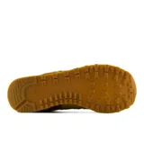 Championes New Balance 574 de mujer, en tonos mostaza y marrón, con entresuela ENCAP y el logotipo "N" en los laterales.