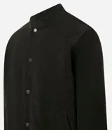 Campera bomber azul marino de pana con cuello redondo, cierre con botones a presión, bolsillos laterales y puños y cintura elastizados.