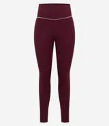Legging deportiva de tiro alto confeccionada en microfibra acanalada color verde militar, con detalle de vivo en contraste en la cintura.