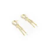 Aros colgantes dorados con forma de lazo y apliques de strass.
