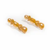 Par de caravanas colgantes con piezas facetadas de color amarillo. Cierre con tuerca a presión.