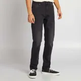 Pantalón de jean negro de corte slim con cinco bolsillos.