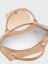 Cartera de mano modelo Le Pliage One tamaño S, confeccionada en nylon negro con detalles en cuero. Presenta cierre superior con solapa y botón a presión característico de la marca.