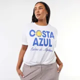 Remera blanca de corte oversize y manga corta, con estampa frontal en tonos azules y amarillos que incluye el texto 'Costa Azul' y 'Palma de Mallorca'.