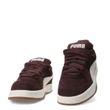Championes urbanos Puma modelo Park Luna Sd, confeccionados en gamuza color marrón con la icónica franja lateral en color beige. Presentan una suela de plataforma en color blanco con base de goma color caramelo.