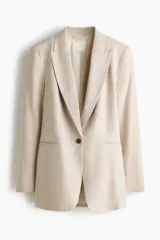 Blazer de botonadura sencilla en mezcla de lino, color beige, con solapas de pico, hombreras y un botón frontal.