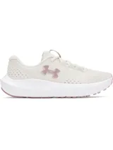 Championes de running Under Armour modelo Charged Surge 4, color beige con detalles en rosado. Presentan parte superior de malla transpirable, entresuela Charged Cushioning para mayor amortiguación y suela de goma resistente.