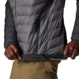 Campera técnica Columbia con tecnología Omni-Heat termorreflectante y aislamiento Thermarator. Presenta un diseño bicolor en tonos gris oscuro y gris medio, con capucha ajustable, cierre frontal completo, bolsillos laterales con cremallera y puños elásticos.