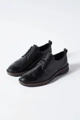 Zapato de vestir Ecco St.1 Hybrid de cuero negro con cordones, detalles brogue y suela de goma con tecnología ECCO FLUIDFORM™ Direct Comfort.