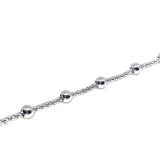 Pulsera de acero con baño de plata y esferas deslizantes decorativas intercaladas en una fina cadena.
