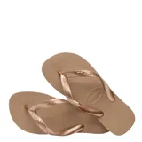 Sandalias tipo ojotas Havaianas, color marrón con acabado metalizado en las tiras. Presentan una textura granulada en la base y el logo de la marca en relieve.