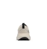 Championes de senderismo Columbia modelo Konos Trs Omni-Max, color beige con detalles en gris. Presentan empeine de malla técnica con sobrecapas sin costuras, sistema Navic Fit para fijación en el mediopié y mediasuela con tecnología Omni-Max para amortiguación y estabilidad. Suela Adapt Trax para tracción en diversas superficies.