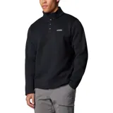 Buzo de forro polar Columbia con cuello alto y cierre frontal parcial con botones a presión. Presenta un diseño liso en color negro con el logo de la marca bordado en el pecho.