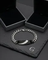 Pulsera de eslabones de acero con placa central rígida bicolor en negro y plateado, decorada con una pequeña circonia incrustada.