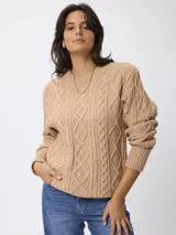 Sweater de tejido de punto con diseño de ochos, cuello redondo y mangas largas con puños acanalados.