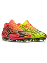 Championes de fútbol Under Armour Shadow Elite 4 Mach FG, en tonos rojo, negro y amarillo flúor. Presentan un diseño aerodinámico con empeine texturizado, cuello elástico de punto, cordones integrados y tapones cónicos en la suela.