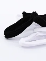 Pack de seis coleros elásticos para el pelo, tres blancos y tres negros.