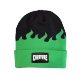 Gorro de lana tipo beanie con diseño de llamas en color negro sobre base verde. Cuenta con un parche rectangular negro en el frente con el logo de la marca Creature bordado en blanco.