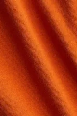 Musculosa cropped color naranja, de punto suave de algodón, con corte holgado, escote en U y bajo recto.