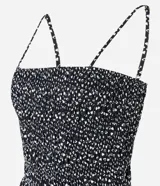 Vestido midi evasé de breteles finos con estampa de corazones, escote recto, lastex en el tronco y recorte fruncido en la cintura. Confeccionado en tricolina con algodón certificado.