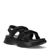 Sandalias de plataforma chunky color negro, con tiras anchas de tela y ajuste con velcro en el empeine y el talón.