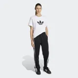Pantalon deportivo Adidas modelo Adibreak de corte holgado, color negro con franjas laterales blancas y las icónicas tres tiras en negro. Presenta botones a presión a lo largo de los laterales y logo de la marca en la parte inferior.