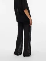 Pantalón negro de punto single jersey con corte wide leg, tiro alto y cintura elástica con cordón ajustable.