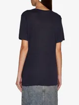 Camiseta de lino Isabel Marant Étoile, color tostado, con cuello redondo y logo estampado en color plateado en el pecho.