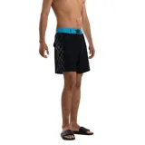 Short de baño Quiksilver Next Gen negro con cintura celeste, cordón de ajuste negro y estampado lateral con el logo de la marca en colores celeste, amarillo y fucsia.