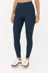 Calza larga azul de cintura alta.