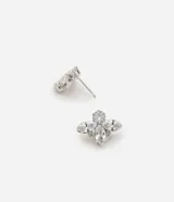 Caravana pequeña con diseño de media flor, compuesta por piedras de zirconia engarzadas en una base metálica.