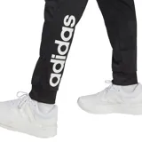 Conjunto deportivo Adidas, modelo Linear Logo Tricot, color negro con detalles blancos. Incluye campera con cierre frontal y pantalón con cintura elástica.