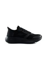 Championes deportivos Umbro modelo Flux, color negro, de diseño moderno y suela texturizada.